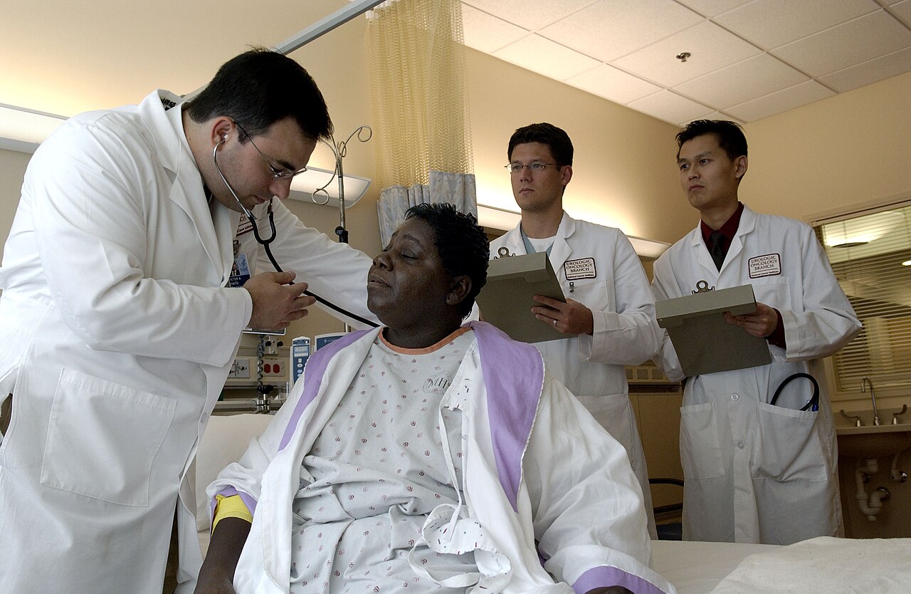 Doctor Performing Clinical Patient Examination with Immediate System Consultation
