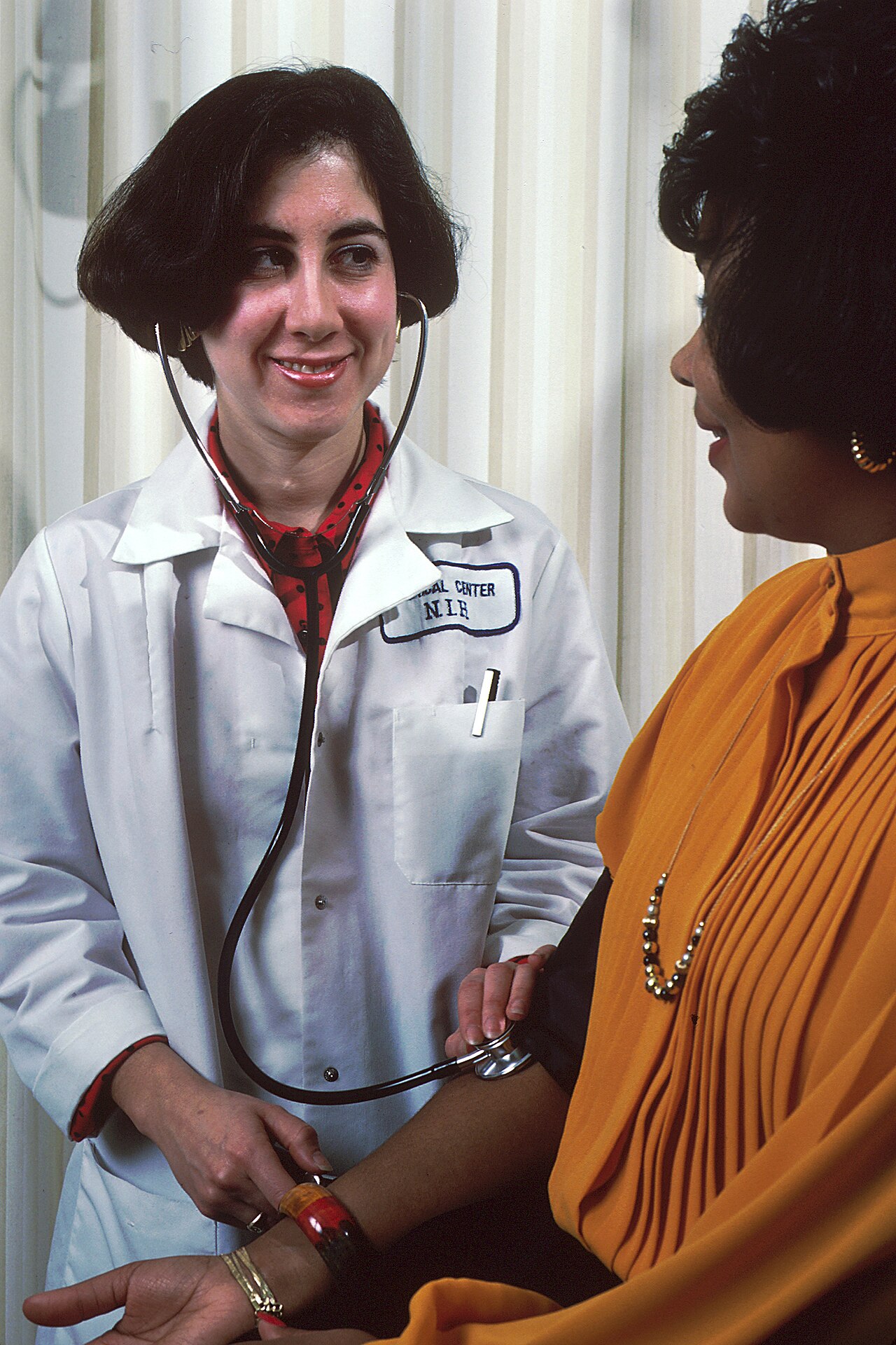 Clinical Nurse Recording Patient Vitals and Triage Metrics